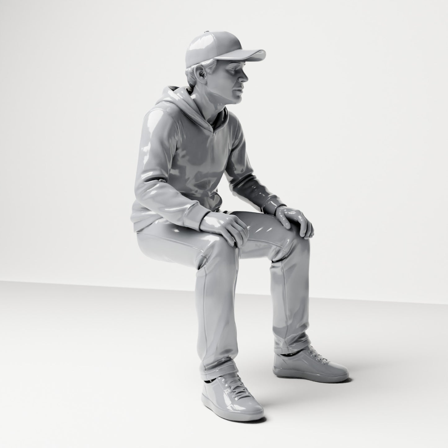 Diorama Modellbau Produktfoto 3: Sitzende Figur: Mann mit Kappe & Kapuzenpullover (B070)