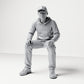 Diorama Modellbau Produktfoto 0: Sitzende Figur: Mann mit Kappe & Kapuzenpullover (B070)