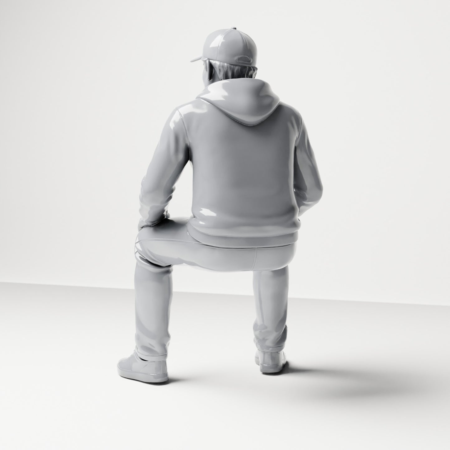 Diorama Modellbau Produktfoto 2: Sitzende Figur: Mann mit Kappe & Kapuzenpullover (B070)