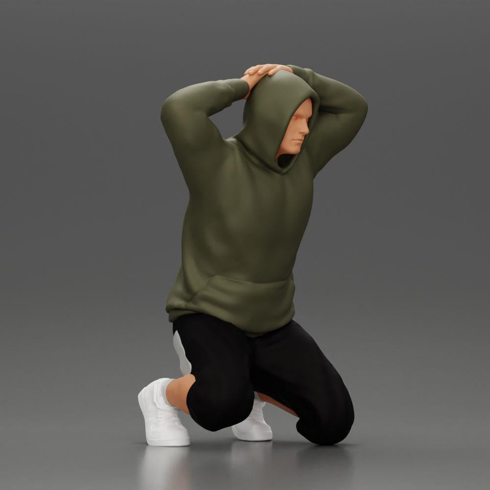 Diorama Modellbau Produktfoto 0: Kniender Mann mit Kapuzenpullover, Hände hinter dem Kopf - Diorama Miniatur (Ref Nr. A70)
