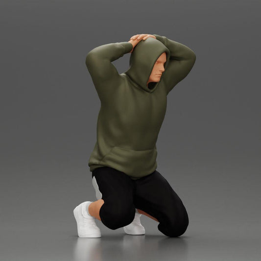 Diorama Modellbau Produktfoto 0: Kniender Mann mit Kapuzenpullover, Hände hinter dem Kopf - Diorama Miniatur (Ref Nr. A70)