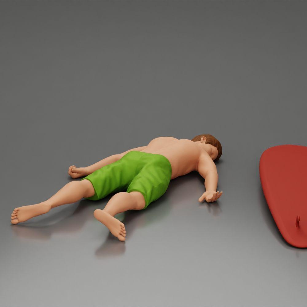Diorama Modellbau Produktfoto 1: Diorama-Miniatur: Liegende Person bäuchlings neben Surfbrett mit Finnen (Ref Nr. A66)