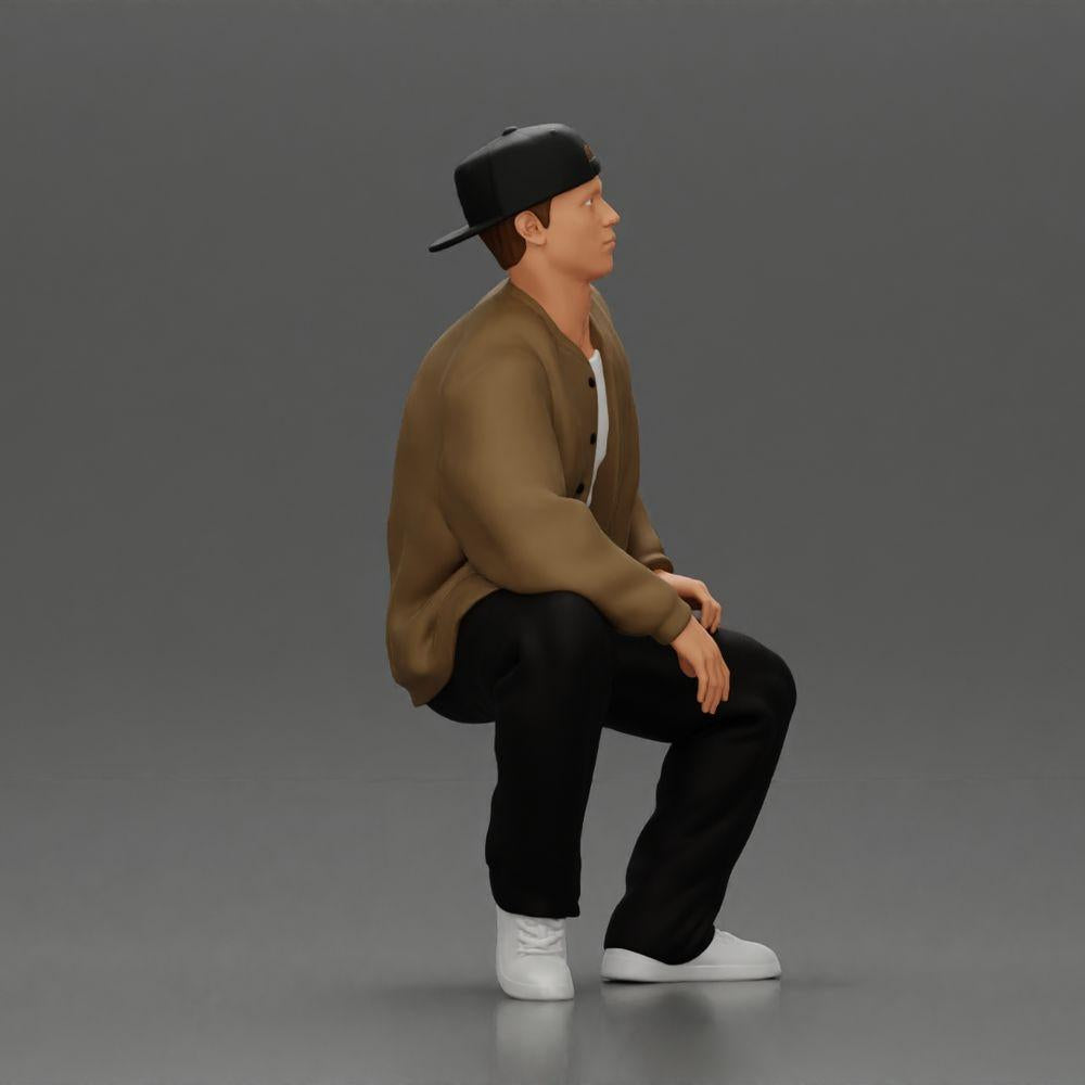Diorama Modellbau Produktfoto 1: Diorama-Figur: Sitzender Hip-Hop-Mann mit Jacke, Cap und Sneakers (Ref Nr. A62)