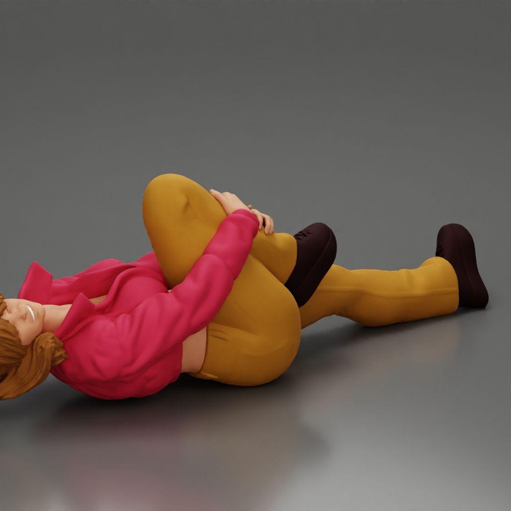 Diorama Modellbau Produktfoto 1: Liegende Frau mit Minijacke hält verletztes Knie - Diorama-Miniatur (Ref Nr. A87)