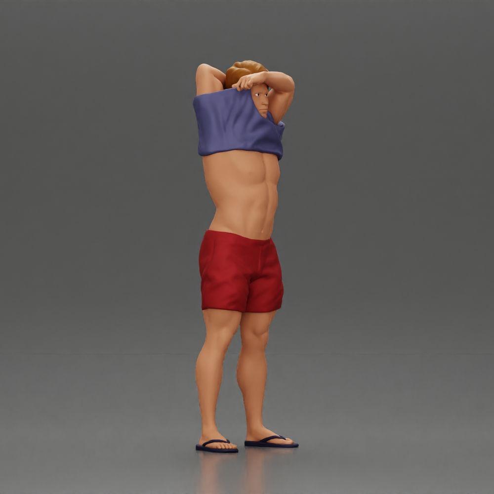 Diorama Modellbau Produktfoto 1: Stehende Miniatur: muskulöser Mann in Shorts zieht T-Shirt über den Kopf (Ref Nr. A90)