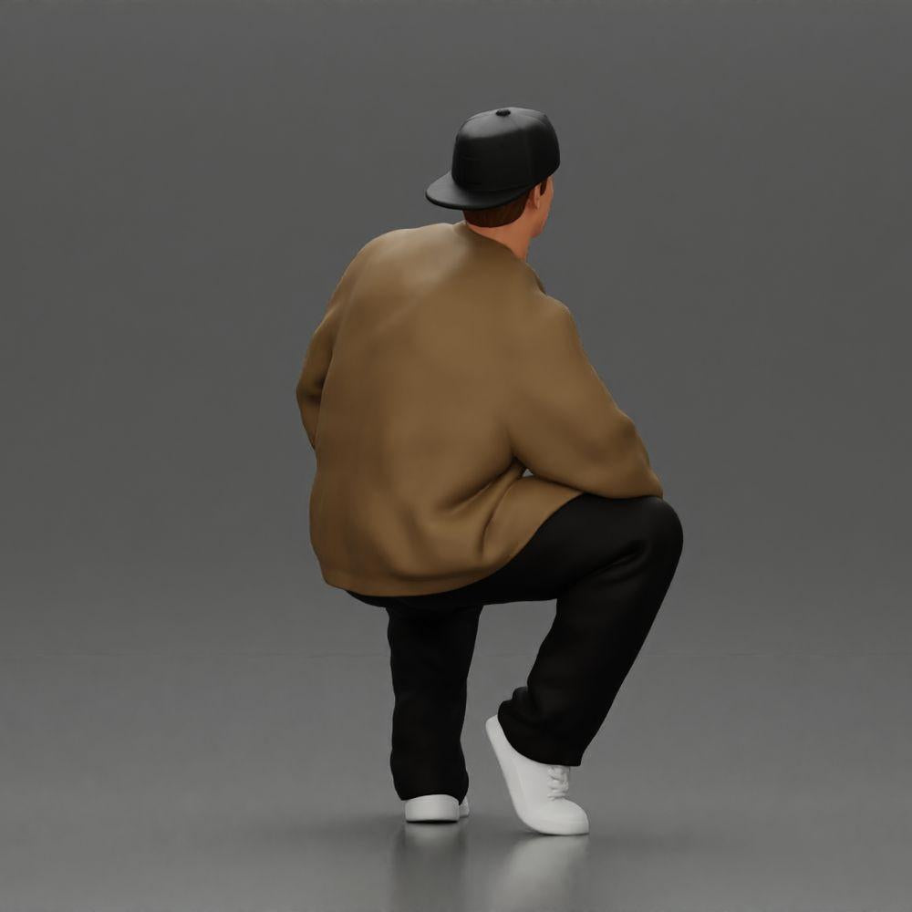 Diorama Modellbau Produktfoto 2: Diorama-Figur: Sitzender Hip-Hop-Mann mit Jacke, Cap und Sneakers (Ref Nr. A62)