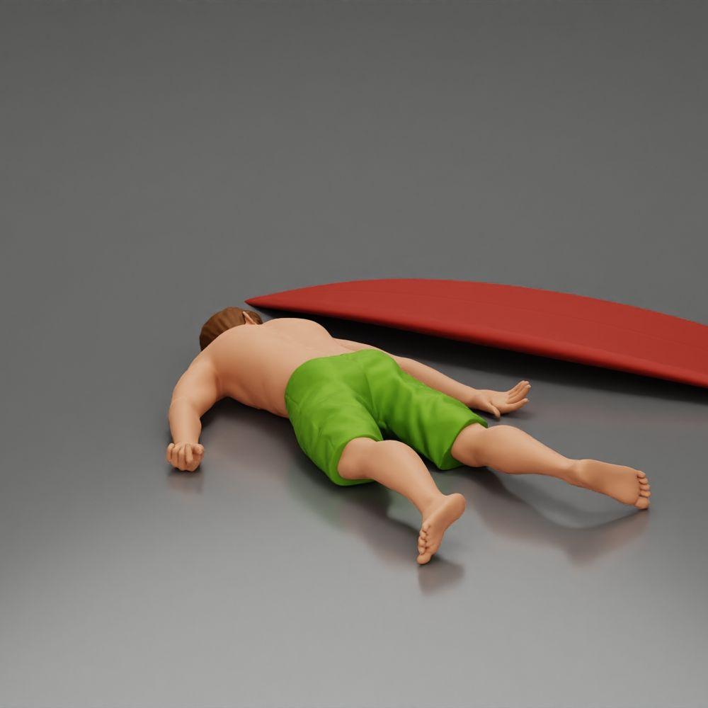 Diorama Modellbau Produktfoto 2: Diorama-Miniatur: Liegende Person bäuchlings neben Surfbrett mit Finnen (Ref Nr. A66)