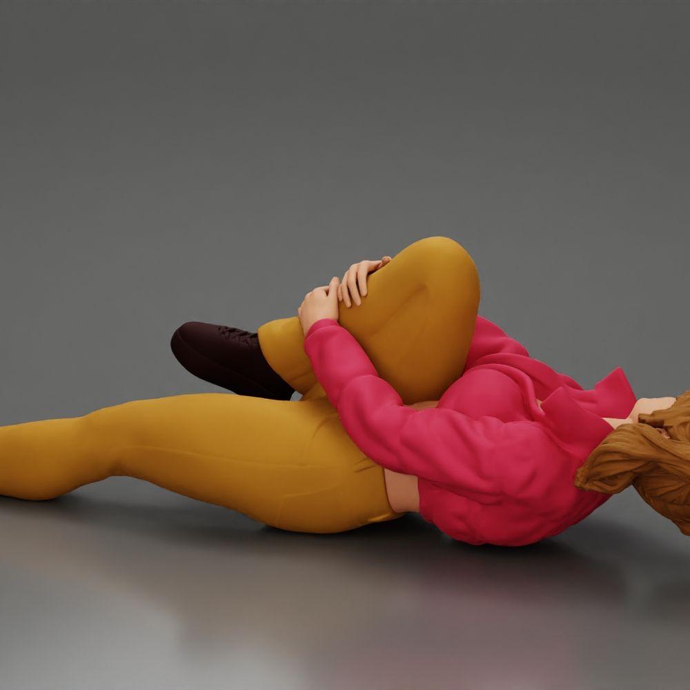 Diorama Modellbau Produktfoto 3: Liegende Frau mit Minijacke hält verletztes Knie - Diorama-Miniatur (Ref Nr. A87)