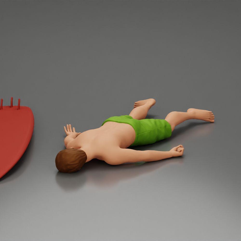 Diorama Modellbau Produktfoto 4: Diorama-Miniatur: Liegende Person bäuchlings neben Surfbrett mit Finnen (Ref Nr. A66)